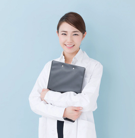 young asian doctor on blue background